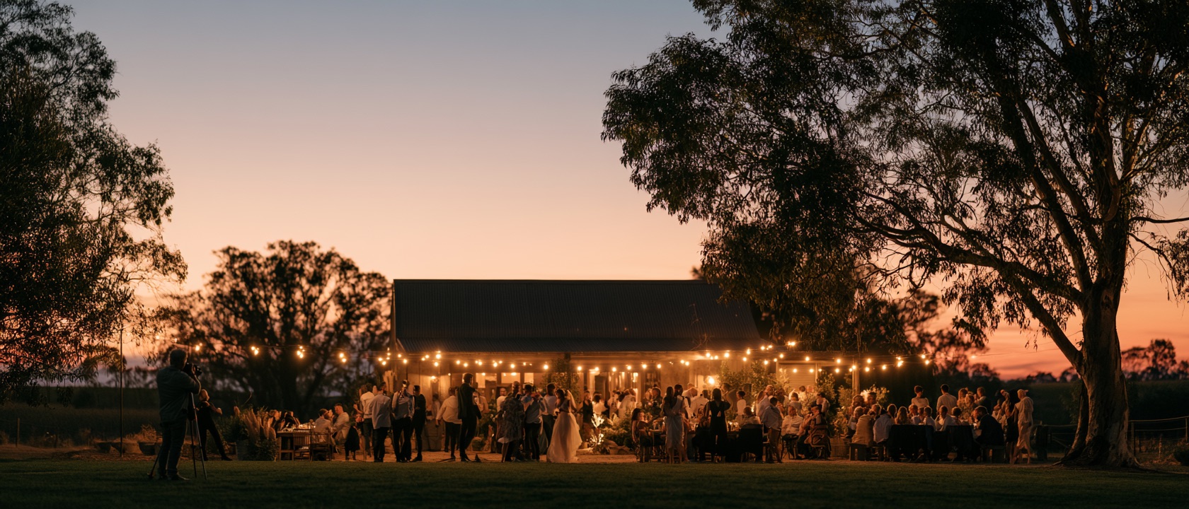 Wedding photographer documenting an evening celebration at sunset